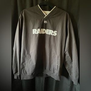 Black and grey mens NFL jacket, Raiders NFL team. Size L. With pockets